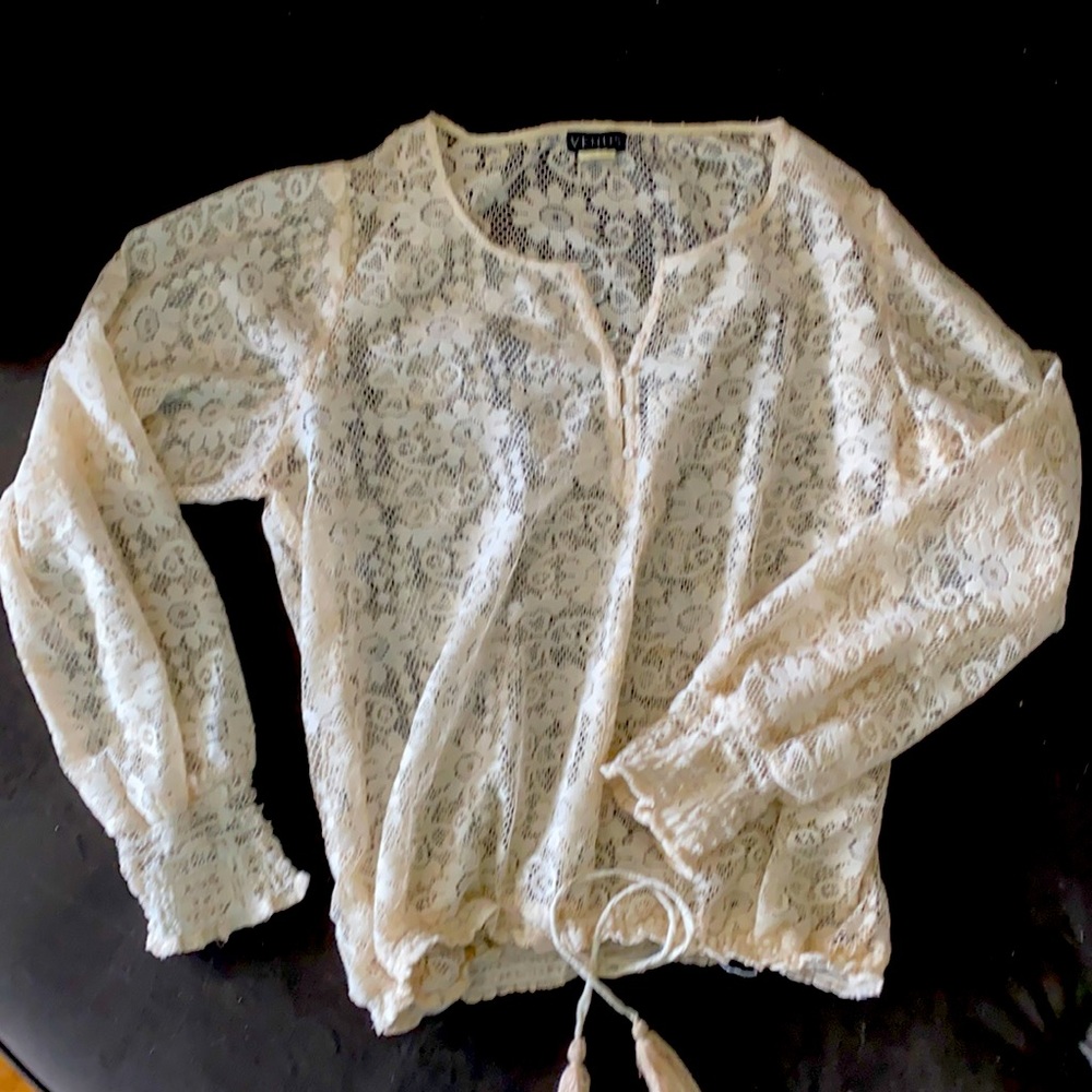 Lace blouse with adjustable waist.